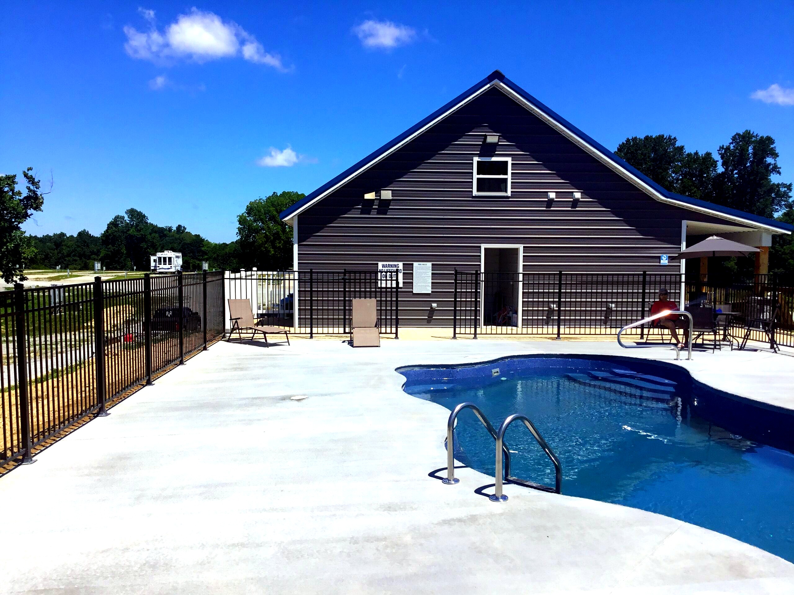 Swimming pool with lounge chairs and clubhouse