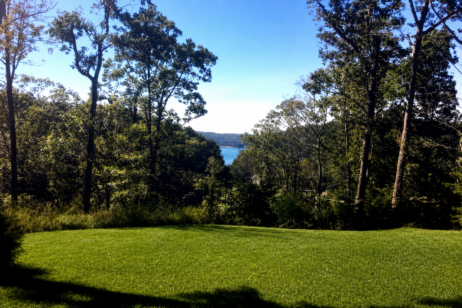 Scenic overlook of Lake Cumberland through the trees from the campground
